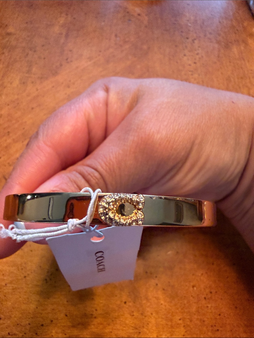 Coach Gold-Tone Crystal 'C' Hinge Bangle Bracelet - Picture 1 of 6